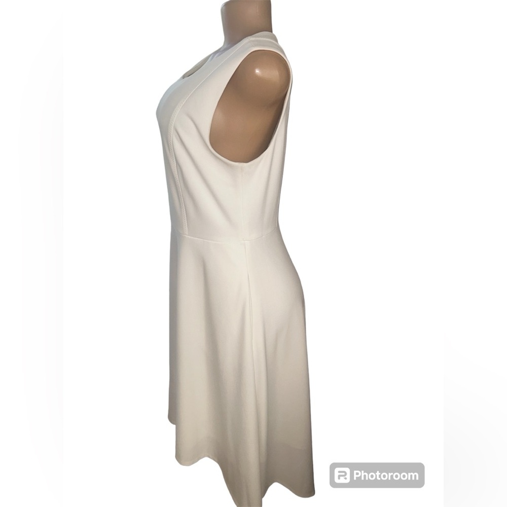 Donna Karan A-line white dress in a size 10 sleeveless and back zip closure.